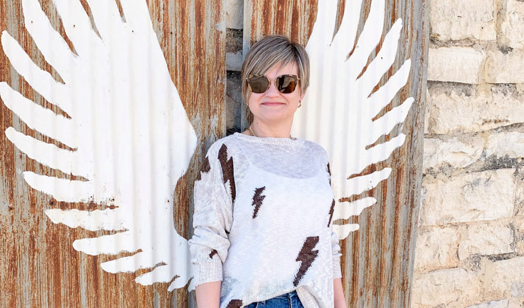 lightning bolt sweater and jeans and sneakers