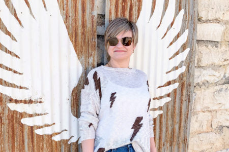 lightning bolt sweater and jeans and sneakers