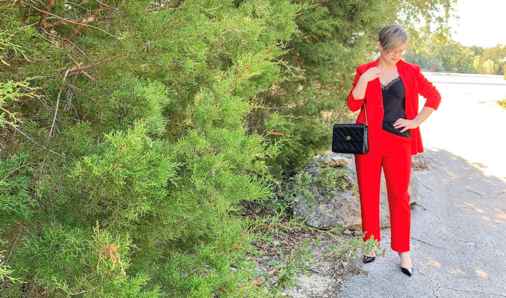 red suit with black cami and heels