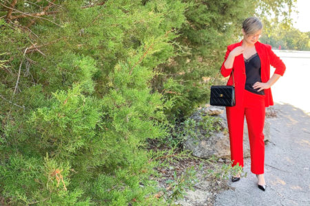 red suit with black cami and heels